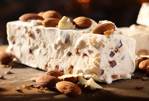 Weißer Nougat und seine Bedeutung Weißer Nougat mit Mandeln